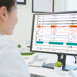 Image of clinician reviewing sleep laboratory testing data on computer screen