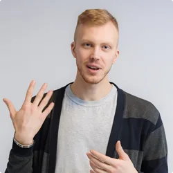 Image of patient talking and gesturing to camera