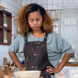Image of woman showing frustration with hands on hips